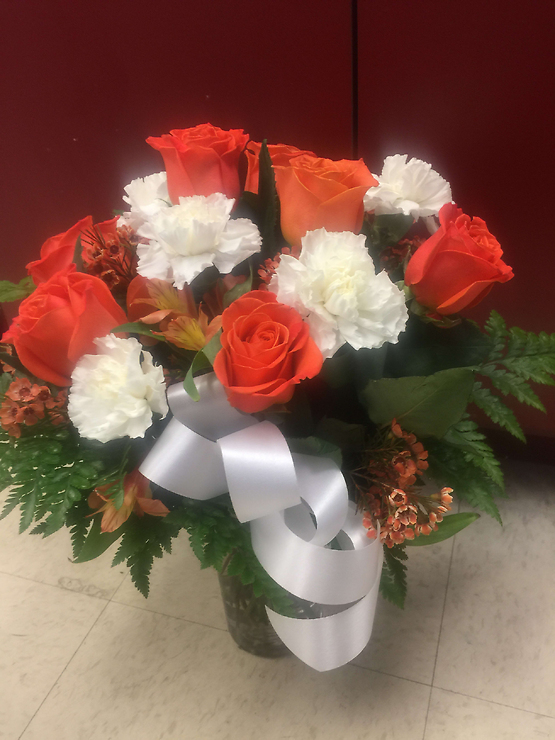 Orange roses and white carnations